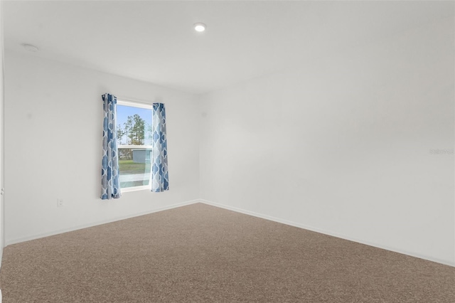 unfurnished room with carpet