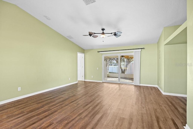 spare room featuring ceiling fan, lofted ceiling, and hardwood / wood-style flooring