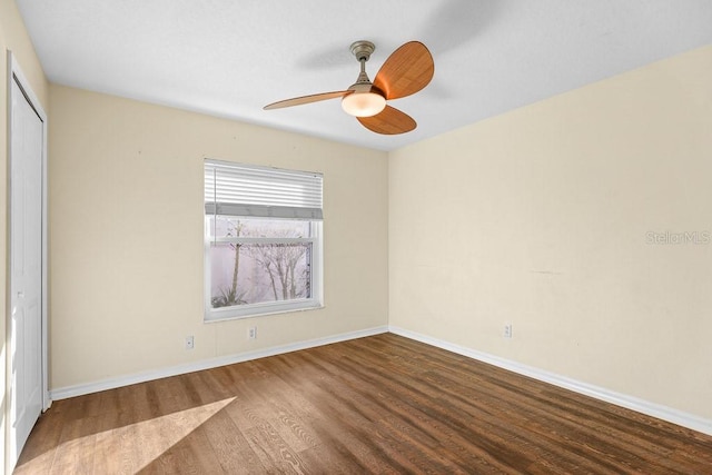 unfurnished bedroom with hardwood / wood-style flooring, ceiling fan, and a closet