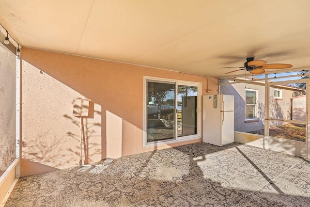 view of patio featuring ceiling fan