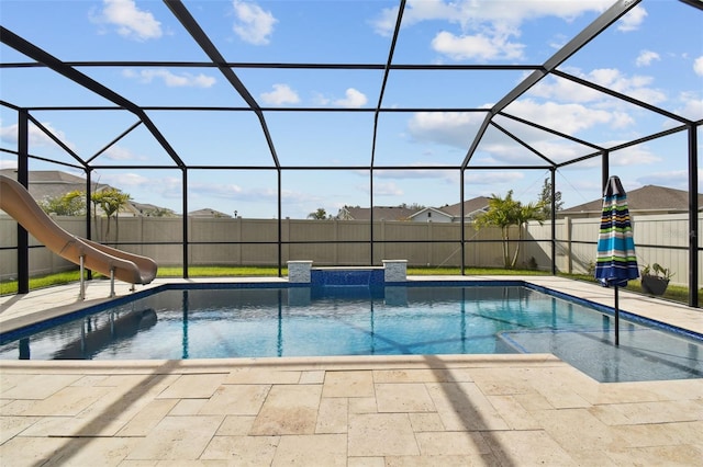 view of pool featuring a lanai, a patio, and a water slide