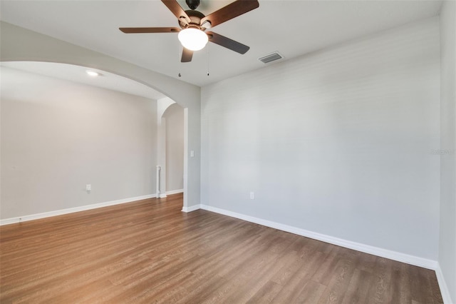 spare room featuring ceiling fan and hardwood / wood-style flooring