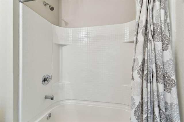 bathroom with shower / bath combination with curtain