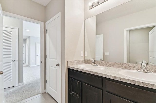 bathroom featuring tile patterned floors and vanity