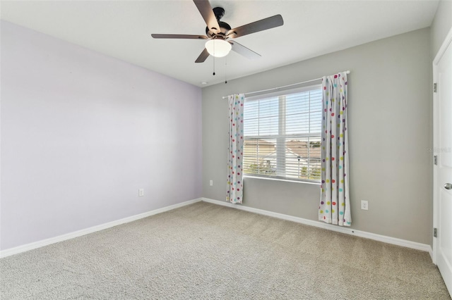 unfurnished room with carpet flooring and ceiling fan