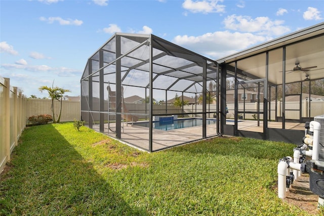 exterior space featuring a lanai, a yard, and a patio