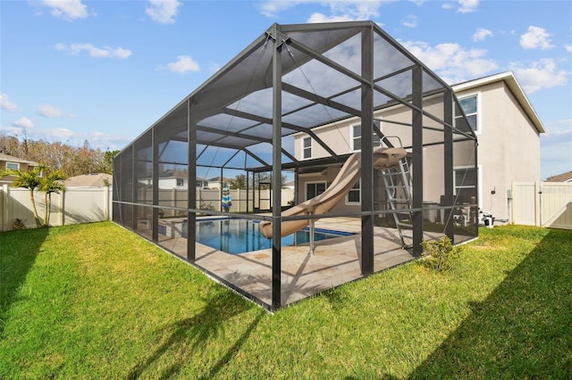 back of property featuring a lanai, a lawn, a patio, and a fenced in pool