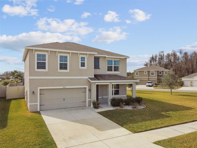 view of front of home featuring a garage and a front lawn