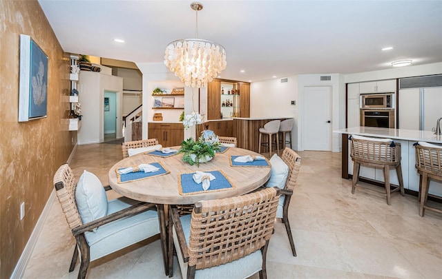 dining space with a notable chandelier