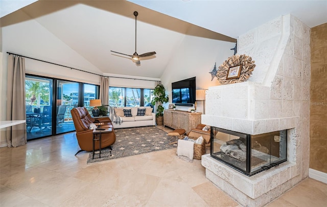 living room with ceiling fan, high vaulted ceiling, and a fireplace