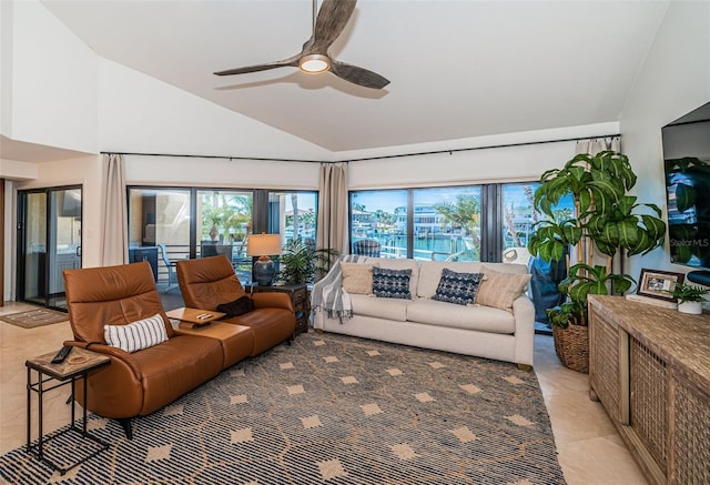 living room with lofted ceiling, light tile patterned floors, and ceiling fan