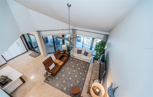 living room with high vaulted ceiling