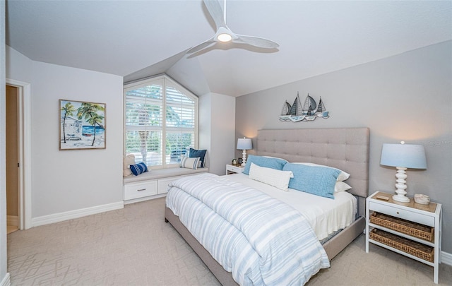 bedroom with vaulted ceiling, light carpet, and ceiling fan