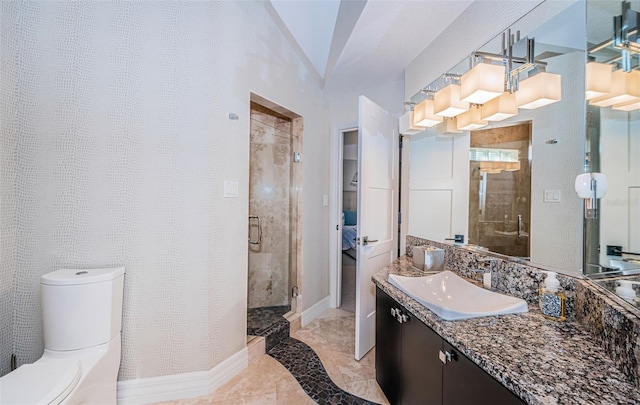 bathroom with vanity, a shower with shower door, and toilet