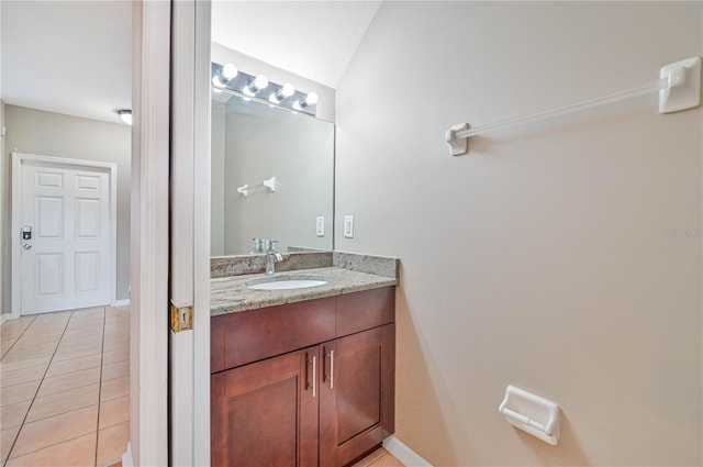 bathroom with tile patterned floors and vanity