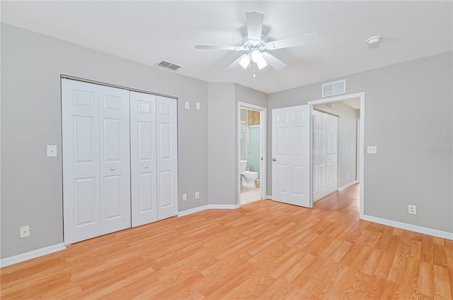 unfurnished bedroom featuring ceiling fan, light hardwood / wood-style flooring, and ensuite bathroom