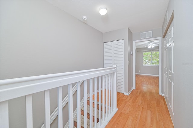 hallway with light wood-type flooring