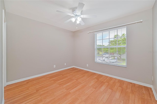 empty room with ceiling fan and light wood-type flooring