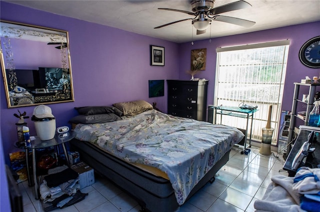 bedroom with ceiling fan and light tile patterned flooring