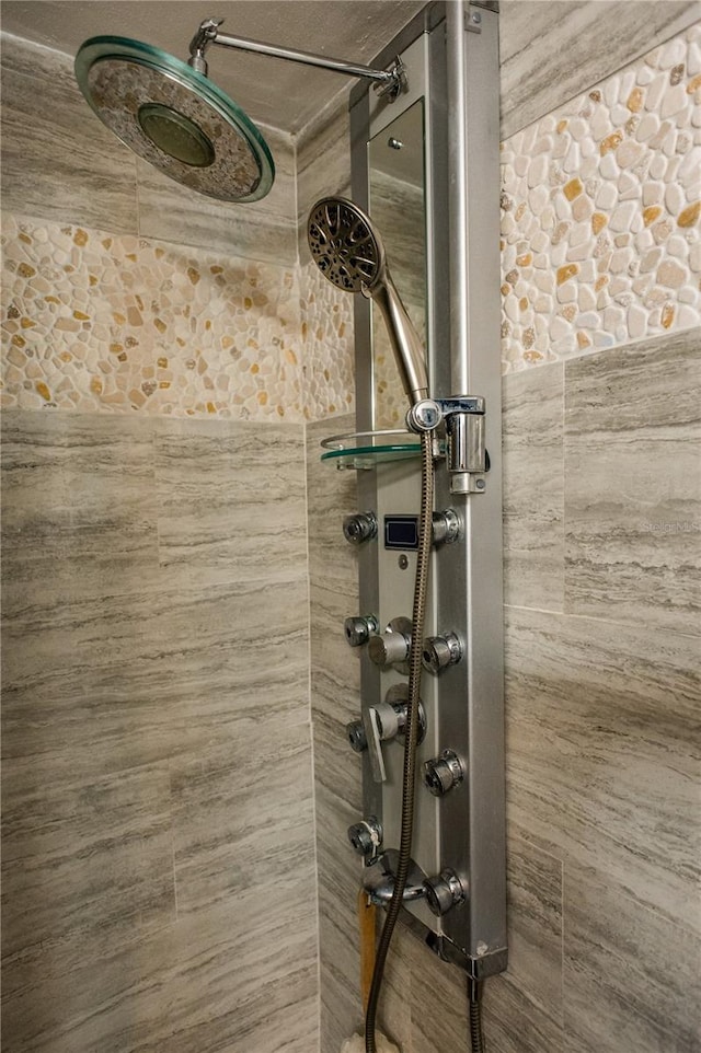 interior space featuring a tile shower