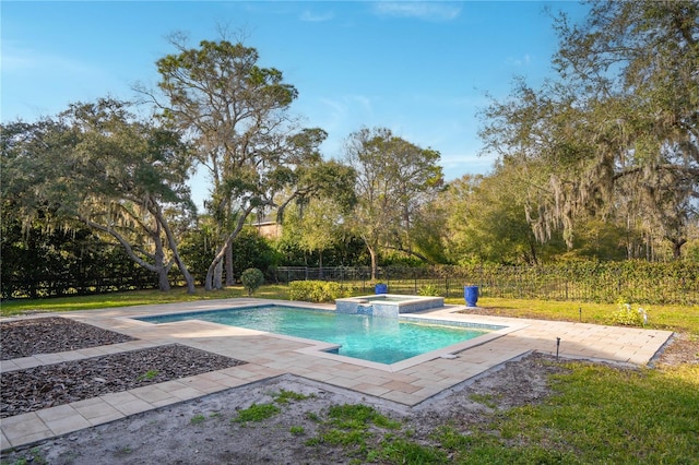 view of swimming pool with an in ground hot tub and a patio