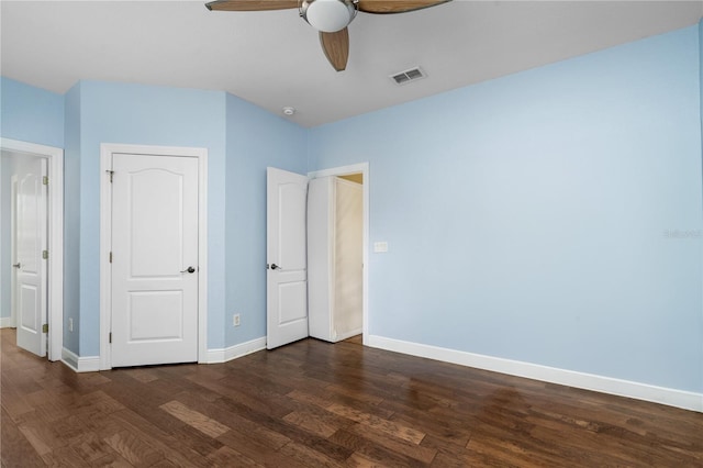 unfurnished bedroom featuring dark wood-type flooring and ceiling fan