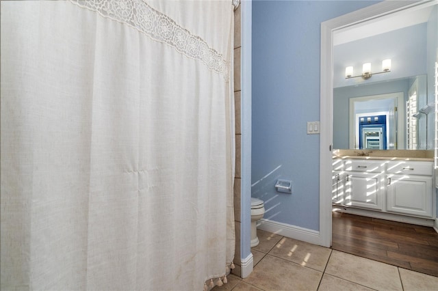 bathroom featuring tile patterned floors and toilet