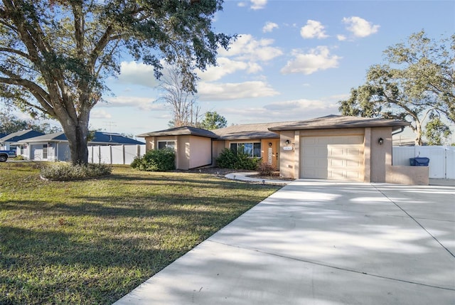 view of front facade with a garage and a front lawn