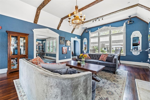 living room featuring track lighting, dark hardwood / wood-style flooring, lofted ceiling, and an inviting chandelier