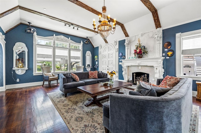 living room with lofted ceiling, a fireplace, dark hardwood / wood-style floors, and a notable chandelier