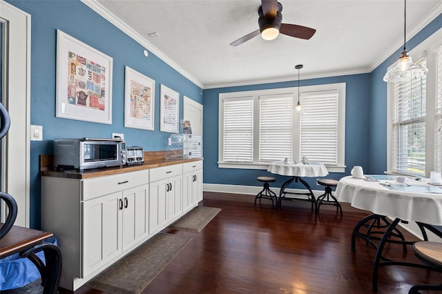 kitchen featuring white cabinets, decorative light fixtures, ceiling fan, and wooden counters