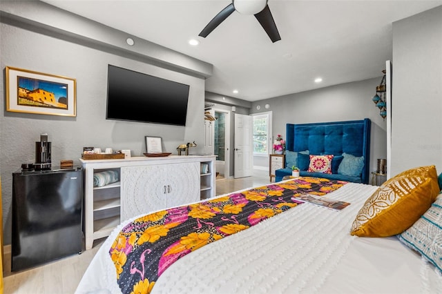 bedroom featuring ceiling fan and light wood-type flooring