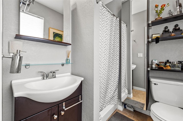 bathroom with tile patterned floors, vanity, toilet, and a shower with curtain