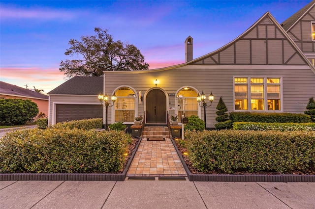 view of front of property with a garage