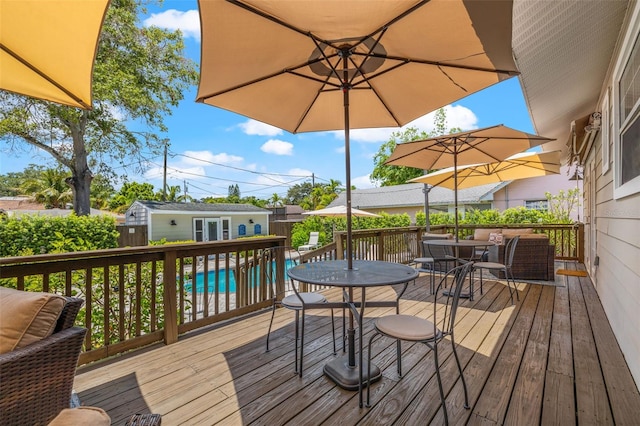 wooden deck featuring an outbuilding