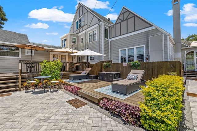 rear view of property with a patio area and a deck