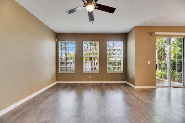 unfurnished room featuring ceiling fan and wood-type flooring