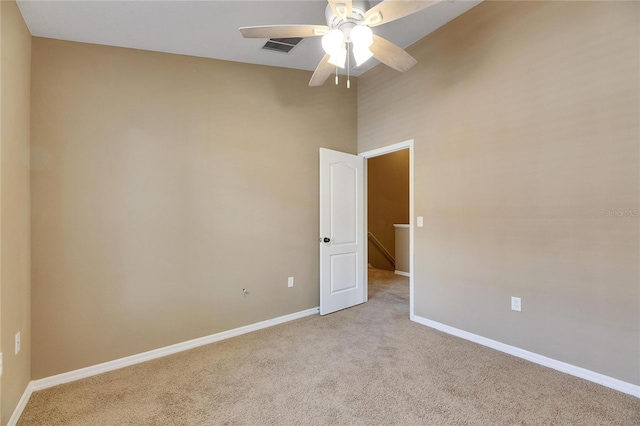 carpeted empty room with ceiling fan