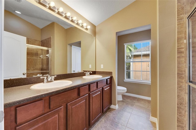 bathroom with vanity, lofted ceiling, tile patterned flooring, toilet, and a shower with shower door