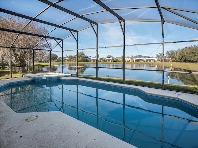 view of swimming pool with glass enclosure, a water view, and an in ground hot tub