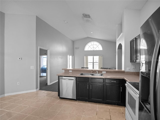 kitchen with dishwasher, sink, white range with electric stovetop, lofted ceiling, and black refrigerator