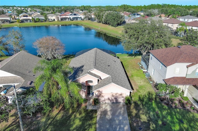 birds eye view of property with a water view