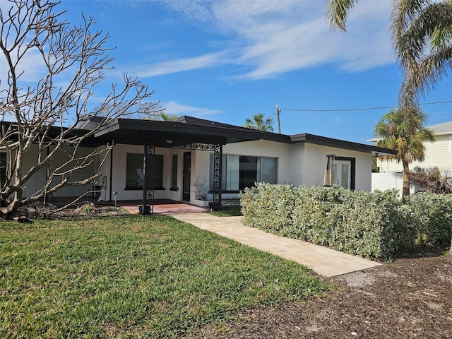 rear view of house with a yard