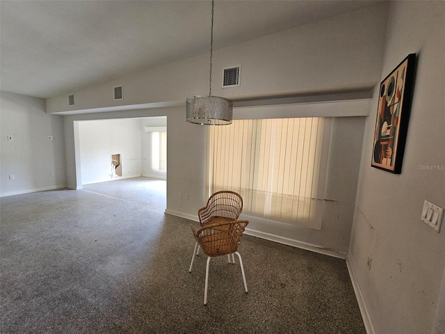 unfurnished dining area featuring lofted ceiling