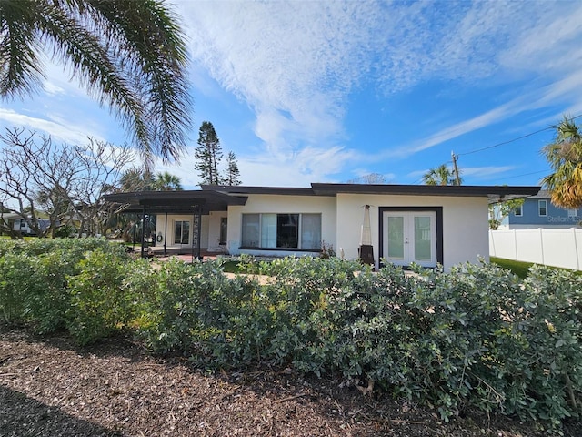 single story home featuring french doors