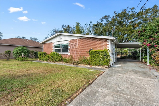 view of front facade featuring a carport and a front yard