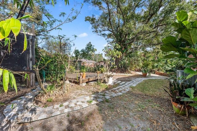 view of yard with a wooden deck