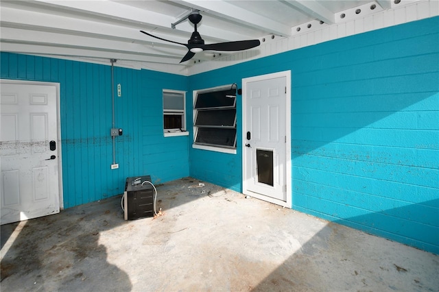 entrance to property featuring a patio and ceiling fan