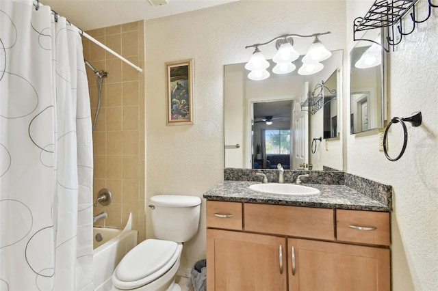 full bathroom with ceiling fan, shower / bath combo with shower curtain, vanity, and toilet