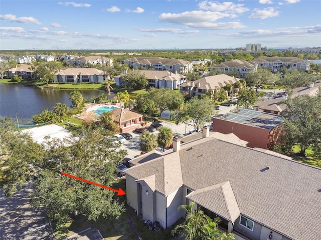 drone / aerial view with a water view